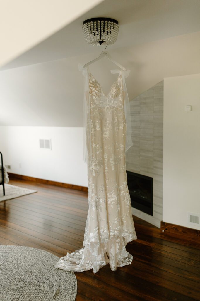 A photo of a wedding dress hanging that was purchased from Belle Amour Bridal in Toledo, Ohio