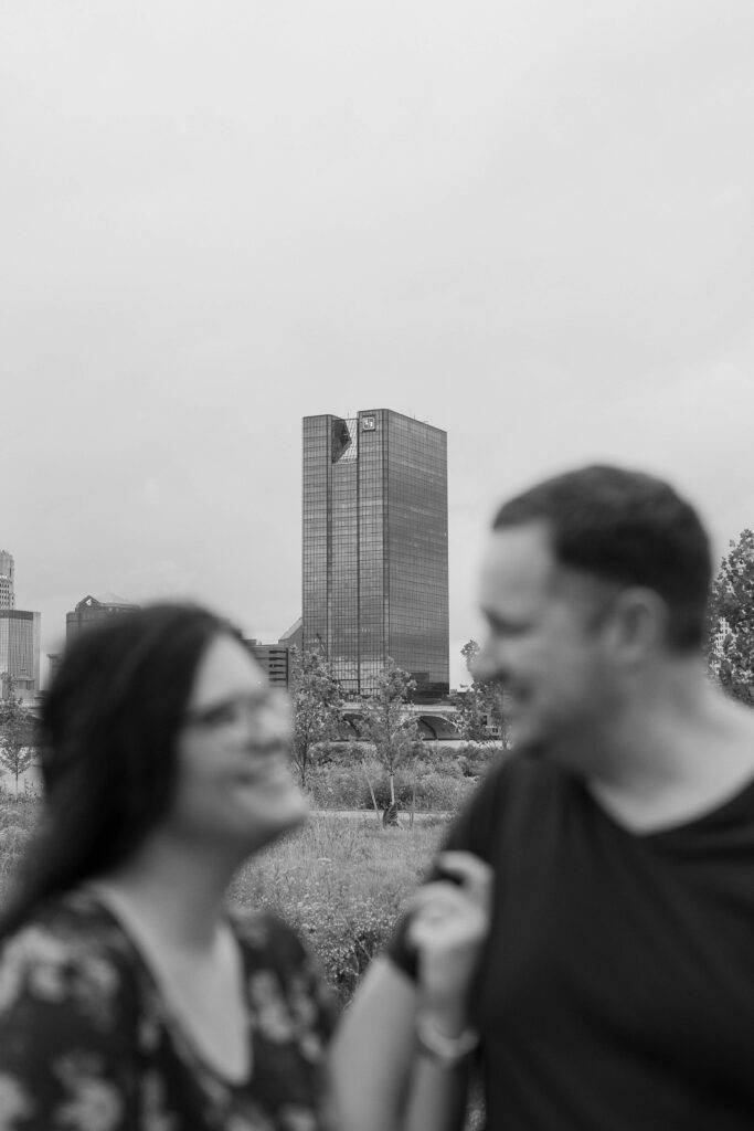 Engagement photos at Glass City Metropark with the Fifth Third Building in the background